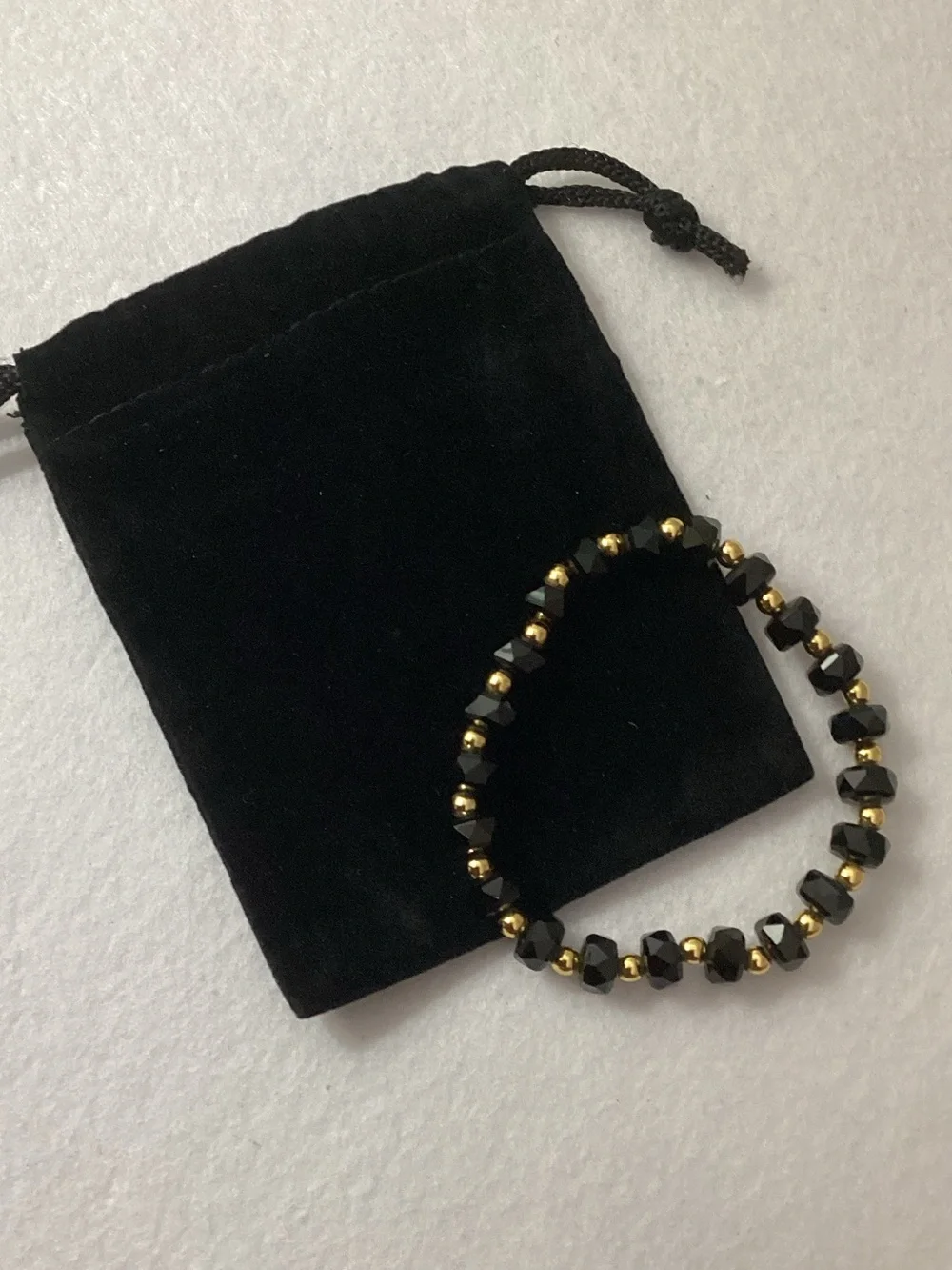 Macy’s Black Crystal and 14K Gold Plated Ball Stretch Bracelet